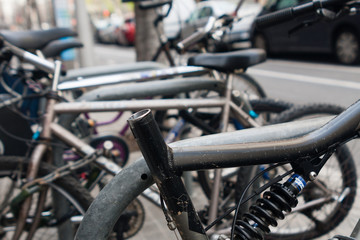 Fototapeta na wymiar bicycles without seats parking on the street
