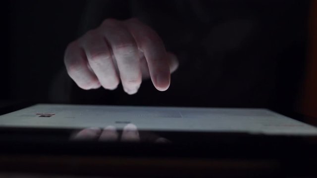Woman browsing online portfolio on digital tablet computer, finger using modern wireless device on internet