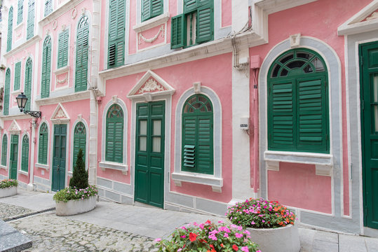 The traditional quaint houses in pink Portugal style and vintage.