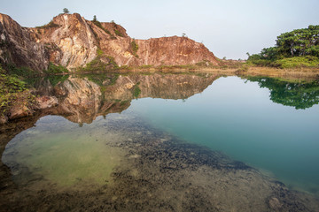 Fototapeta na wymiar Green lake and reflection of mountain