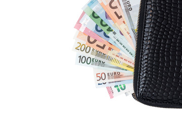 euro banknotes in leather black purse isolated on white background
