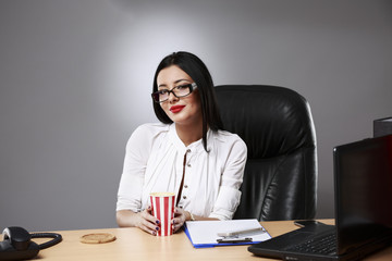 Young beautiful businesswoman is relaxing at office.