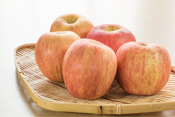 Red apple in basket