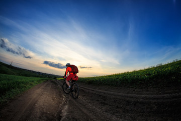 Obraz premium Young man is riding bicycle outside. Healthy Lifestyle.