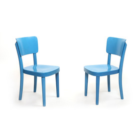 Two classic blue chairs in empty room. Furniture on white background. Idea of dialogue. Picture with space for your text.