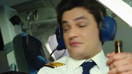 Drunk pilot gulping beer from bottle during flight, saying cheers to crewmembers