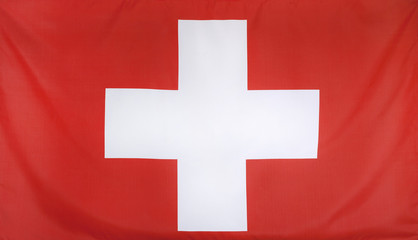 Obraz premium Switzerland Flag real fabric seamless close up