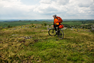 Obraz premium Young man is riding bicycle outside. Healthy Lifestyle.