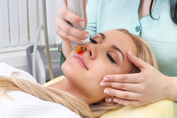 Obraz na płótnie Canvas Woman having facial hair removal laser.