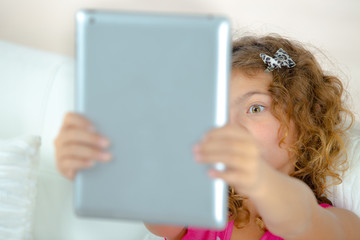 Little girl using a tablet computer