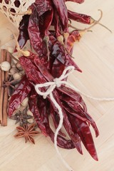 Dried chili for cooking on wood background.