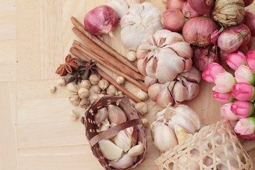 Shallot and garlic for cooking on wood background.