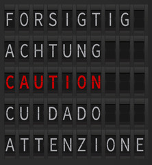 Caution sign in different languages on black mechanical board which is digitally generated. Airport timetable style board. Caution sign in red color.