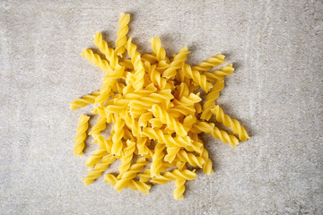 Pasta shells on stone table, from above