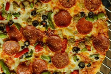 Well cooked pizza on the oven rack