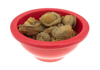 Small bowl of smoked scallops isolated on a white background