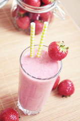 Strawberry smoothie or milkshake in the glass jar, healthy concept