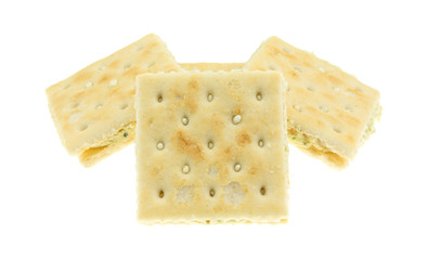 Group of four cream cheese and chives crackers isolated on a white background