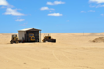 Road machinery in desert