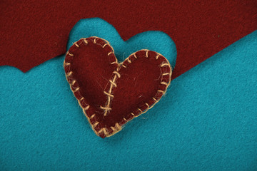 Felt craft and art brown heart cut out on blue
