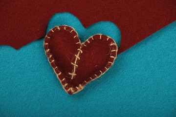 Obraz premium Felt craft and art brown heart cut out on blue