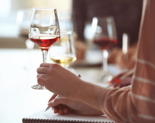 Experts tasting new sorts of wine at the table