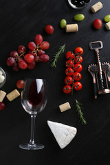 Wine, snacks and different various of cheese, flat lay