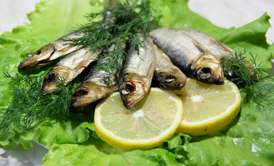 Smoked fish served with lemon