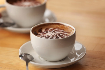 Two cups of coffee with foam, closeup