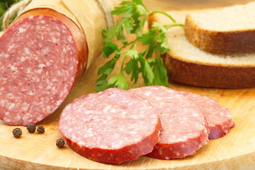 Smoked sausage with spices and greens for sandwiches