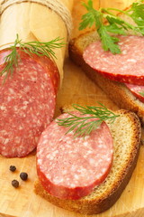 Smoked sausage with spices and greens for sandwiches