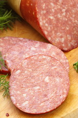 Smoked sausage with spices and greens for sandwiches