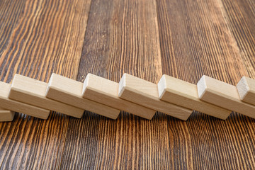 Naklejka na ściany i meble Close-up of wooden bricks lay in a row