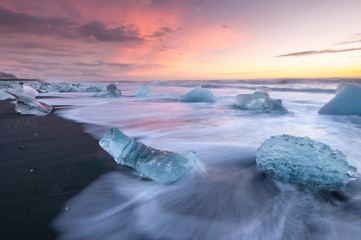 Icebergs on the black sand volcanic beach,  Vatnajokull Glacier, Iceland. - obrazy, fototapety, plakaty