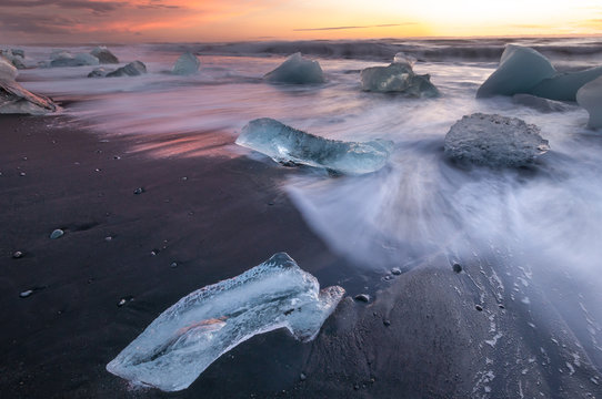 Icebergs on black volcanic beach in glacial lagoon, Iceland. Vatnajokull National Park 