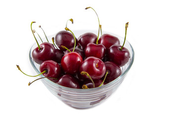 Red fresh cherries on white