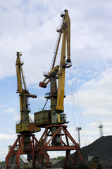Fototapeta na wymiar Hoisting cranes in the commercial port