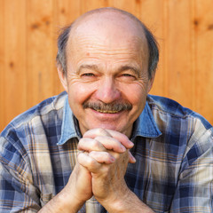 Elderly man dreaming about something. Prayer to God
