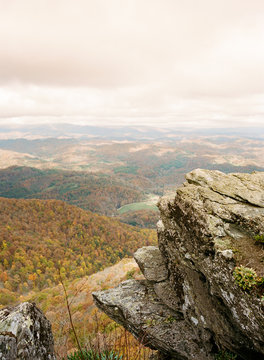 Rocky outcrop with dramatic scenic backdrop