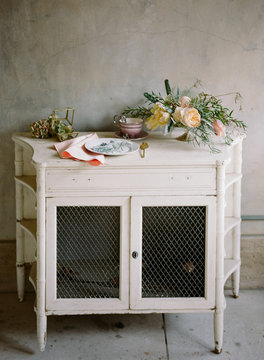 Rustic sideboard with flowers