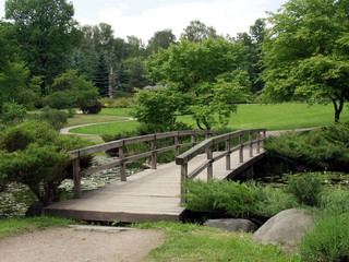 Fototapeta na wymiar Wooden bridge in Japanese garden