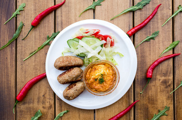 healthy tasty breakfast. Meat and salad. top view