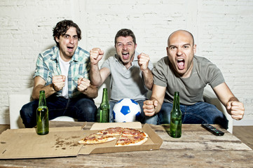 friends fanatic football fans watching game on tv celebrating goal screaming crazy happy
