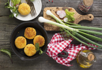 Fototapeta na wymiar Healthy vegetable dinner. Potato cutlets grilled with fresh vegetables