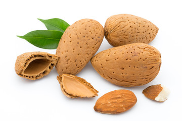 Almonds with leaves isolated on white background