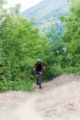 Mountain biker riding cross country