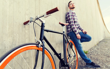 close up of hipster fixed gear bike and man