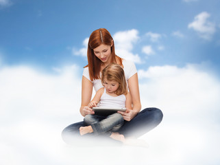 happy mother and little girl with tablet pc
