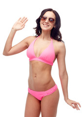 Fototapeta premium happy woman in sunglasses and bikini swimsuit