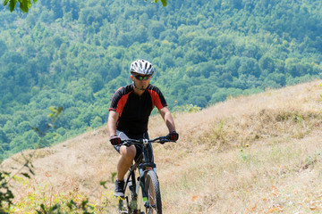 Mountain biker riding cross country